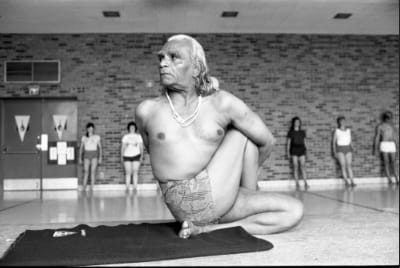 BKS Iyengar demonstrates a yoga pose Ardha Matsyendrasana